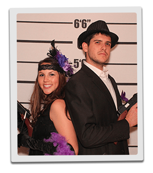 Phoenix Murder Mystery party guests pose for mugshots