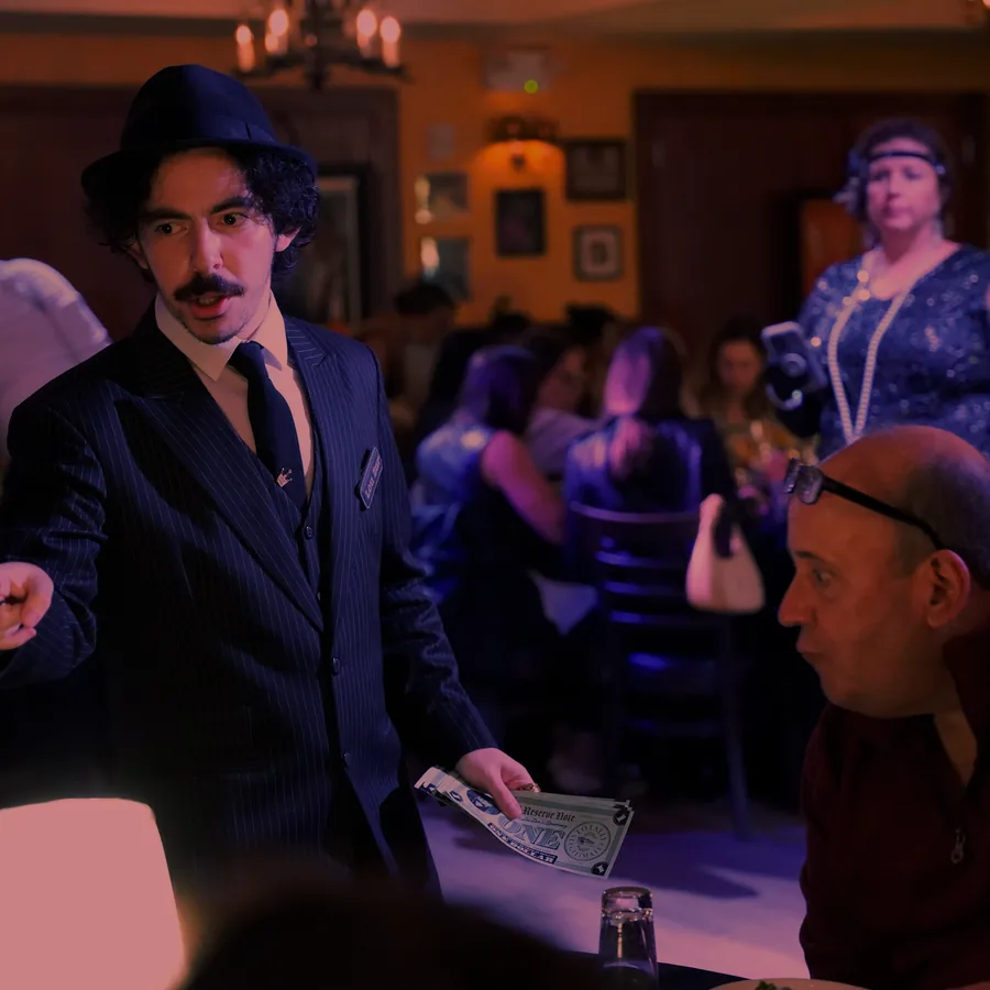 A Murder Mystery Company actor working the room at a Phoenix show