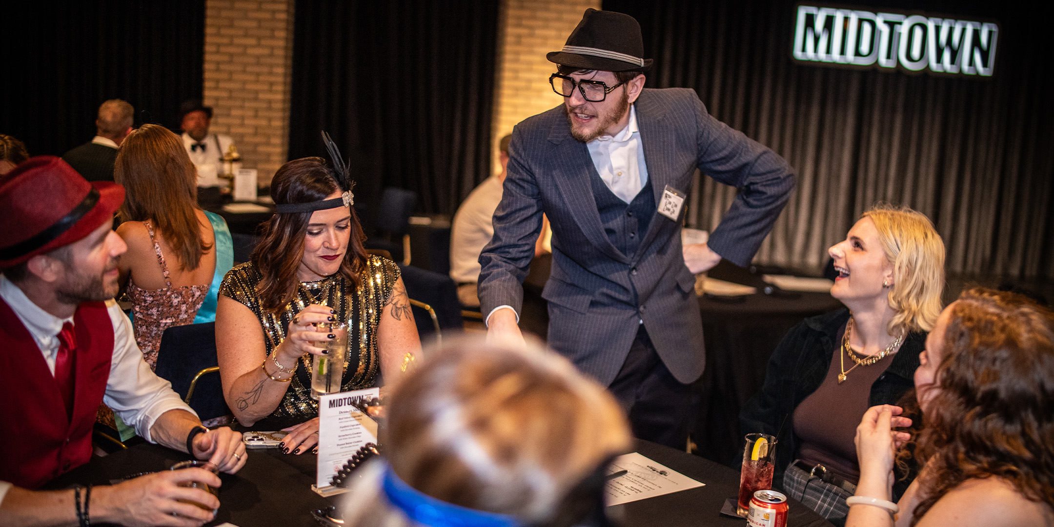 Guests at a Murder Mystery Company public dinner show in Phoenix